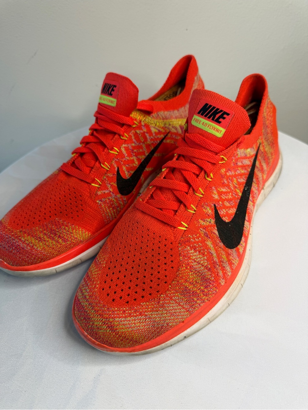 Nike Men’s Flyknit Running Shoes - Vibrant Orange with Black Swoosh
